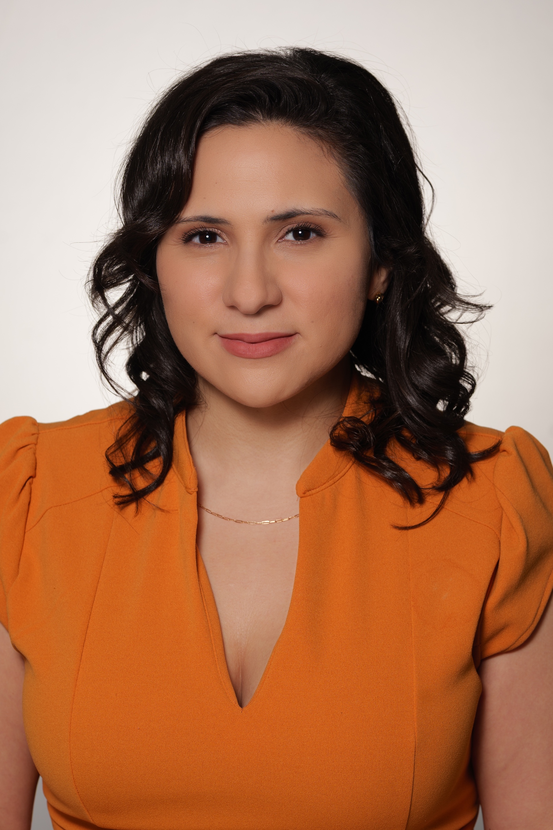 Cyrielle HEadshot Orange Dress